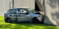Car crashes through facade of bed factory Avek during accident in Surhuisterveen