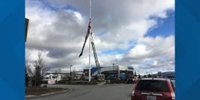 Damaged US flag at Camping World removed with help of Spokane Valley Fire